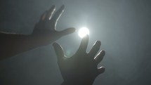 a man reaching for light 
