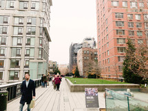 pedestrians walking on city sidewalks in NYC