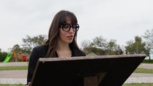 Woman With Eyeglasses Reads The Historical Indications Of The Monument