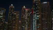 Illuminated Skyscraper Building In The Night City Of Dubai