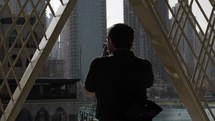 Man takes pictures with his camera in downtown Dubai.