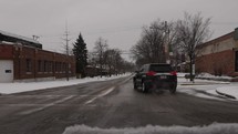 driving through a small town with winter snow 