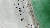 aerial view over people on a beach 