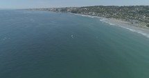 aerial view over kayakers in the ocean 