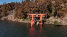 Majestic Mount Fuji Overlooking a Tranquil Lake with Torii Gate