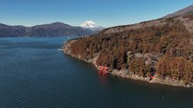 Majestic Mount Fuji Overlooking a Tranquil Lake with Torii Gate