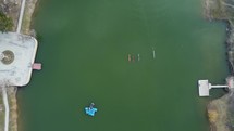 Kayaks in the green lake aerial