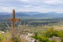 Cross at the Ljubuski Fortress in Bosnia and Herzegovina overlooking the valley below