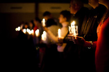 Christmas Eve service - a row of members holding candles