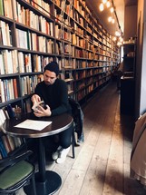 man reading in a library 