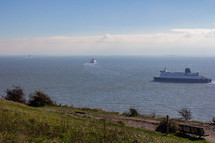 Three ferries leaving Dover port heading toward France