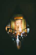 key hole, view of a couple saying vows 