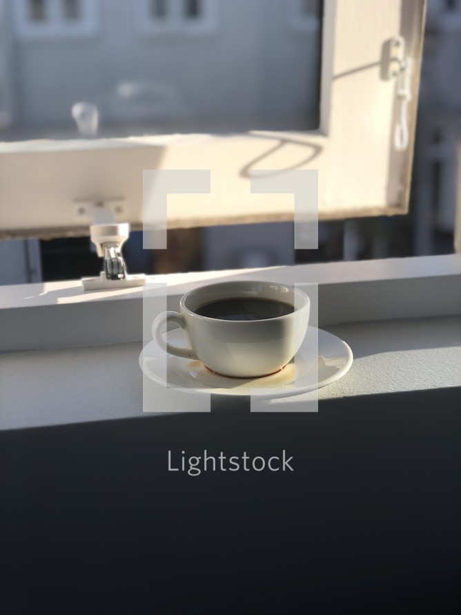 coffee cup in a window 
