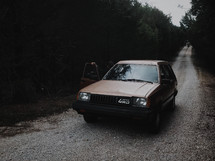 old toyota car on a dirt road 