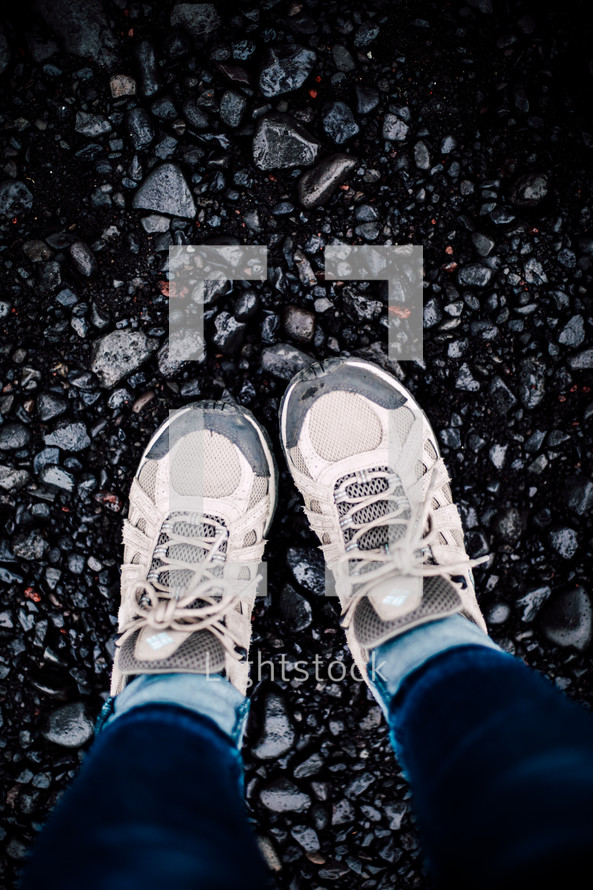 sneakers standing in gravel 