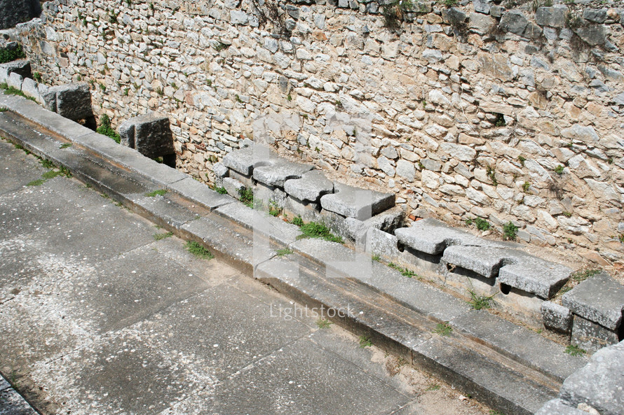 These are the public toilets at the ruins from Ancient Philippi. These toilets date to the 3rd century AD. Philippi was the home of Lydia the merchant who befriended the Apostle Paul in Acts 16 of the Bible. 