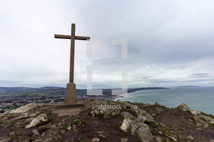stone cross on a mountaintop 