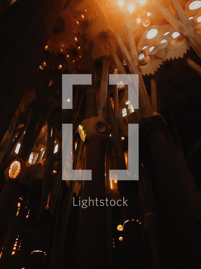 glowing lights and stone detail in a cathedral 