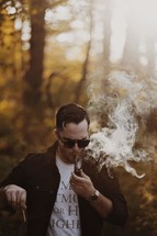 a man smoking a pipe 