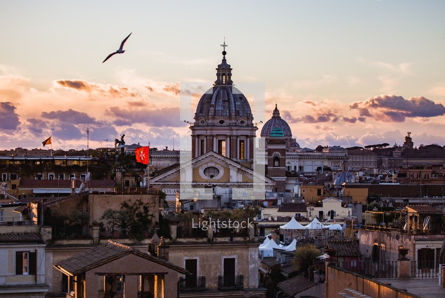 Rome skyline at sunset with St. Peter's Basilica in center