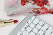 floral scarf, red lipstick, and computer keyboard 