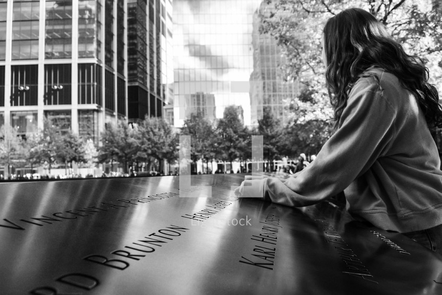 girl visiting the 9/11 memorial 