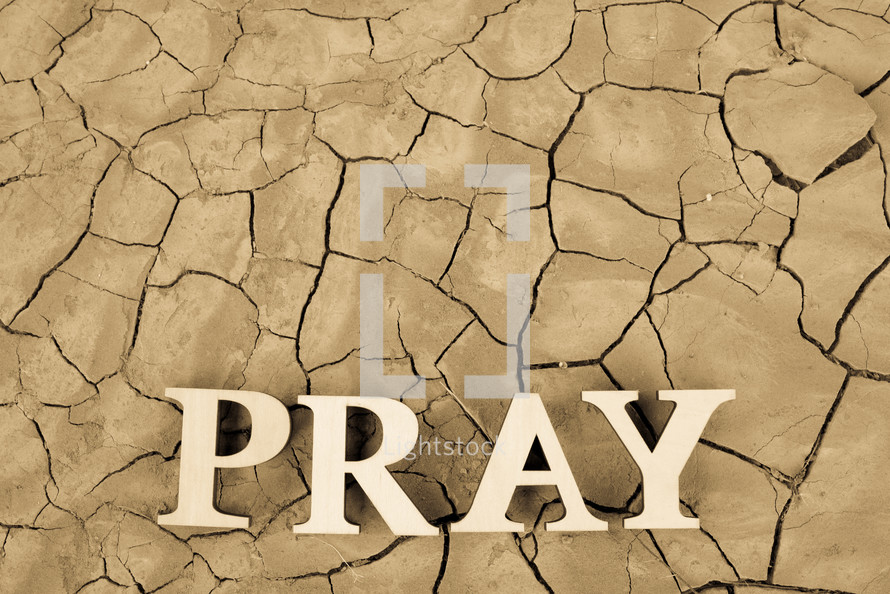 word pray on parched soil 