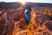 rays of sunlight over a canyon 