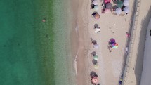 Top down aerial over white sand beach and crystal clear water, Himarë, Albania