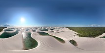 360 aerial photo taken with drone of expansive sand dunes with hundreds of pools of water in Lençóis Maranhenses National Park in Maranhão, Brazil