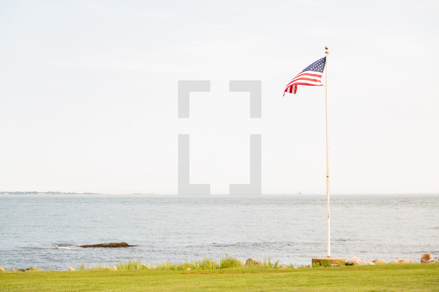 american flag on the shore