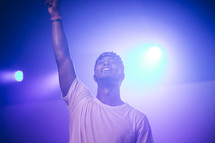 singing, microphone, on stage, man, raised hand, singer, musician, African American, fog machine
