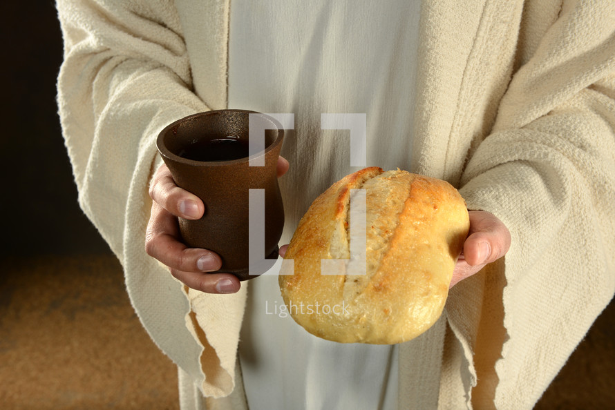 Jesus' hands holding a loaf of bread and a cup of wine.