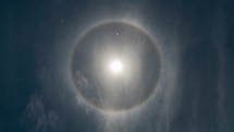 Rare Rainbow Circular Halo Around Sun Optical Phenomenon at Blue Day Light Sky Time Lapse