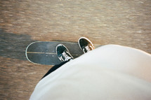 standing on a skateboard 