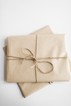 simple gifts wrapped in brown paper 