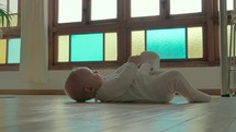 Cute baby playing with foot