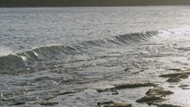 Foamy waves rolling in on the sea shore