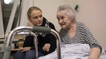 Granddaughter coming to see senior grandma in the hospital