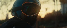 Man Wearing Full Face Helmet In The Sunset
