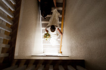 A bride walking down stairs