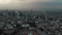 Aerial View Of Mexico City With Modern Towers And Buildings On A Cloudy Day - drone shot	