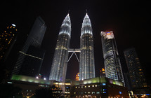 The Petronas Twin Towers in Malaysia at night - Editorial use only
