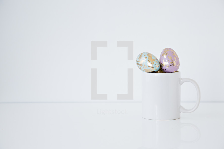 pastel gold speckled Easter eggs in a mug