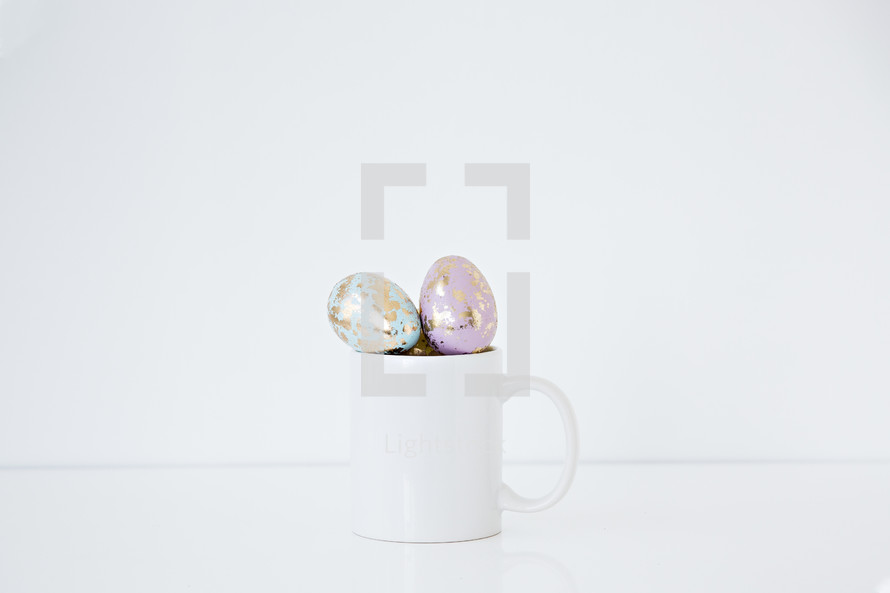 pastel gold speckled Easter eggs in a mug 
