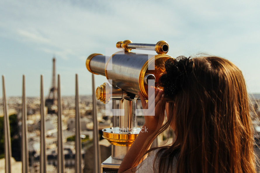 telescope pointing to Eiffel Tower and Paris streets 