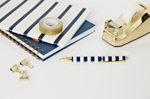 navy and gold items on a desk