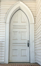 gothic door on a white church 