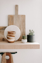 wood bowls on a floating shelf 