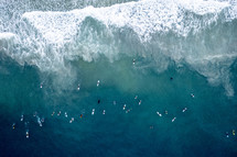 aerial view over surfers in the ocean 